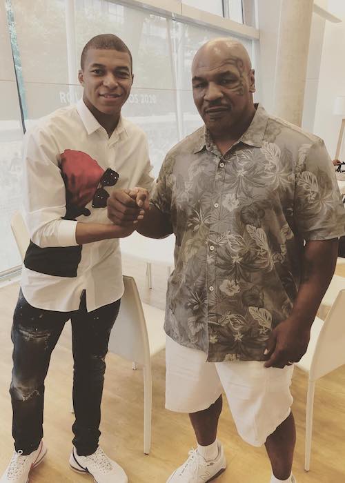 Kylian Mbappé med den tidligere bokser Mike Tyson